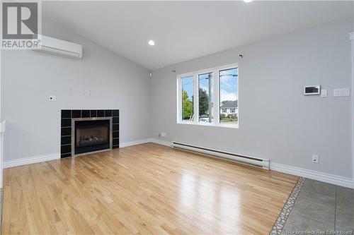 416 Louis Street, Dieppe, NB - Indoor Photo Showing Living Room With Fireplace