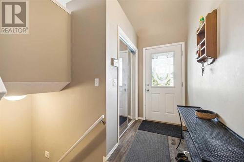 Entry to main floor suite.  Down the stairs - private storage for main floor - 111 Erin Meadow Green Se, Calgary, AB 