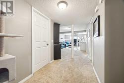 View from bedroom.  Furnace room on the left with storage, laundry room on the right with storage - 