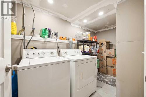 Private laundry for legal lower suite with extra storage - 111 Erin Meadow Green Se, Calgary, AB 