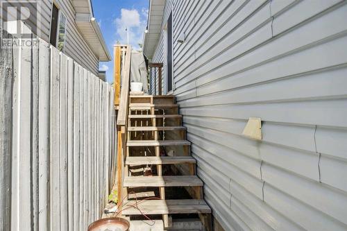 Side deck from upper suite.  Storage under accessible from front yard - 111 Erin Meadow Green Se, Calgary, AB 