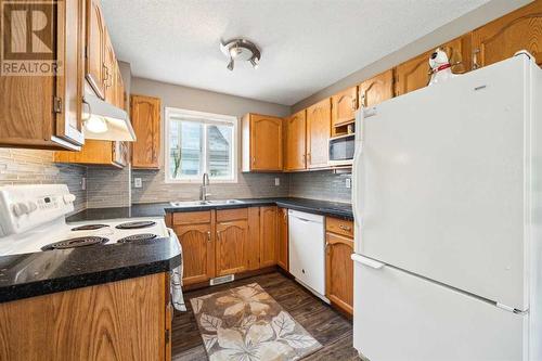 Granite Counters with new backsplash - 111 Erin Meadow Green Se, Calgary, AB 