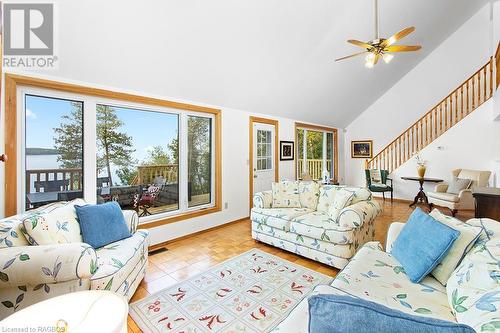 Great water views from the large windows, and option to add a few ceiling skylights too. - 139 Ivy Drive, Georgian Bluffs, ON - Indoor Photo Showing Living Room