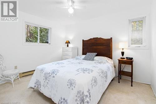 Master bedroom at the end of the balcony walkway. - 139 Ivy Drive, Georgian Bluffs, ON - Indoor Photo Showing Bedroom