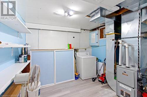 Ample sized laundry and mechanical room with high efficiency forced air furnace. - 139 Ivy Drive, Georgian Bluffs, ON - Indoor Photo Showing Laundry Room