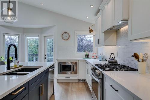 354 Mountain Park Drive Se, Calgary, AB - Indoor Photo Showing Kitchen With Double Sink With Upgraded Kitchen