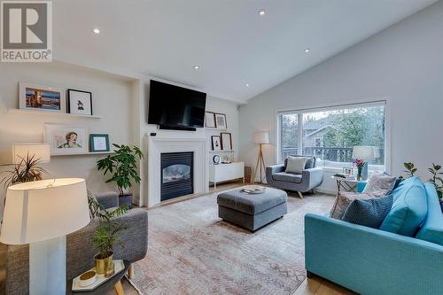 354 Mountain Park Drive Se, Calgary, AB - Indoor Photo Showing Living Room With Fireplace