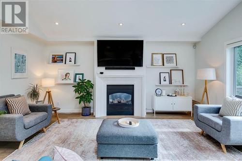 354 Mountain Park Drive Se, Calgary, AB - Indoor Photo Showing Living Room With Fireplace