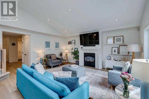 354 Mountain Park Drive Se, Calgary, AB - Indoor Photo Showing Living Room With Fireplace