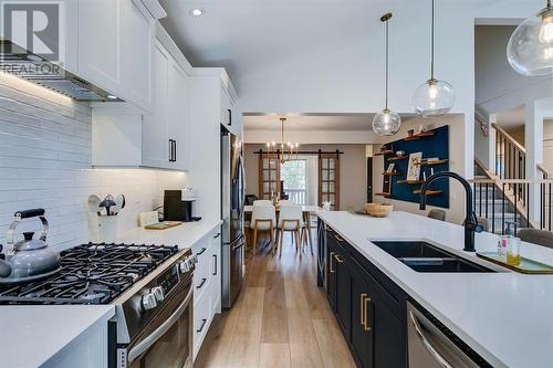 354 Mountain Park Drive Se, Calgary, AB - Indoor Photo Showing Kitchen With Double Sink With Upgraded Kitchen