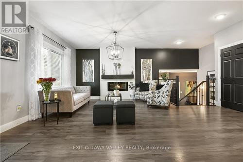 35 Vera Crescent, Whitewater Region, ON - Indoor Photo Showing Living Room With Fireplace