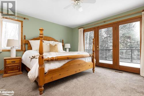 Walkout to Lakeside Dek - 200 Edgemere Road E, Port Sydney, ON - Indoor Photo Showing Bedroom