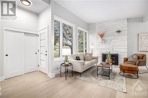 15 Cedarbank Avenue, Ottawa, ON - Indoor Photo Showing Living Room With Fireplace