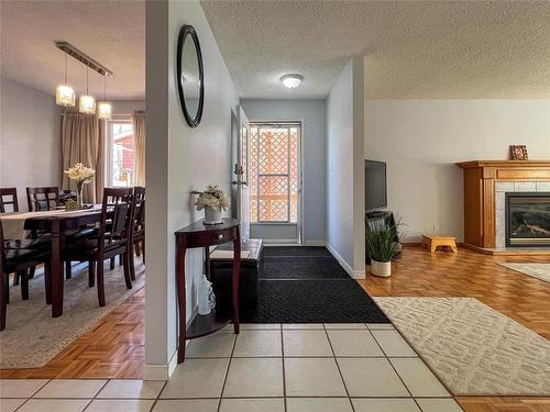 215 Aberdeen Avenue, Brandon, MB - Indoor Photo Showing Other Room With Fireplace