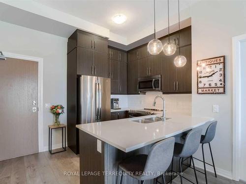 612-1105 Leger Way, Milton, ON - Indoor Photo Showing Kitchen With Double Sink With Upgraded Kitchen