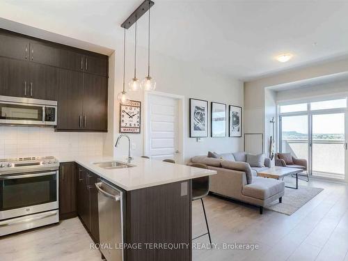 612-1105 Leger Way, Milton, ON - Indoor Photo Showing Kitchen With Double Sink With Upgraded Kitchen