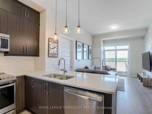 612-1105 Leger Way, Milton, ON - Indoor Photo Showing Kitchen With Double Sink With Upgraded Kitchen