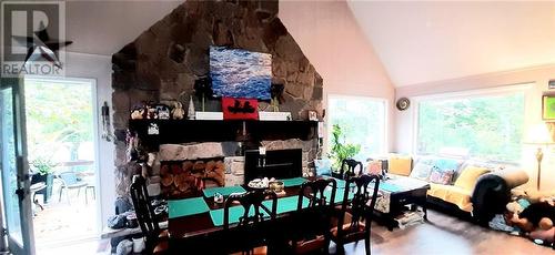 Great Room with entrance to waterside deck! - 324 Rantz Road, Petawawa, ON - Indoor With Fireplace