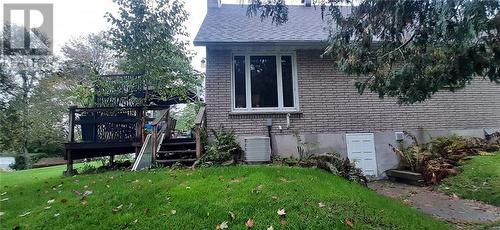 Side view of house and 2nd (outside) entry into crawl space low basement. Access to well equipment and furnace and on demand HTW tank plus storage. - 324 Rantz Road, Petawawa, ON - Outdoor