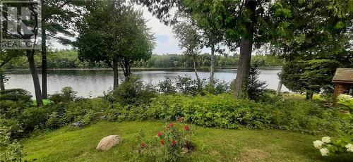 Summer view from bottom yard to water. - 324 Rantz Road, Petawawa, ON - Outdoor With Body Of Water