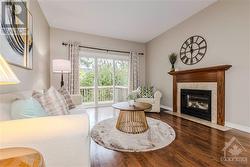 family room with a gas fireplace & access to the backyard - 