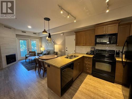 1200 Rancher Creek Road Unit# 302, Osoyoos, BC - Indoor Photo Showing Kitchen With Fireplace With Double Sink