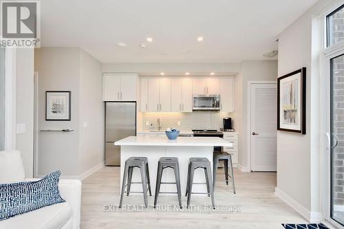 C404 - 301 Sea Ray Avenue, Innisfil, ON - Indoor Photo Showing Kitchen With Stainless Steel Kitchen With Upgraded Kitchen