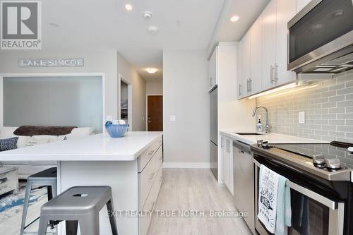 C404 - 301 Sea Ray Avenue, Innisfil, ON - Indoor Photo Showing Kitchen With Upgraded Kitchen