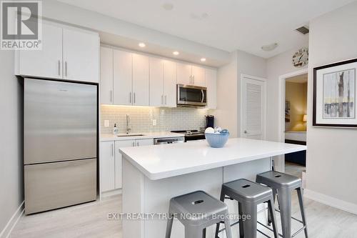 C404 - 301 Sea Ray Avenue, Innisfil, ON - Indoor Photo Showing Kitchen With Stainless Steel Kitchen With Upgraded Kitchen