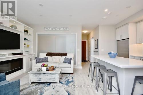 C404 - 301 Sea Ray Avenue, Innisfil, ON - Indoor Photo Showing Living Room