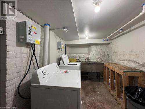 Coin operated laundry for the units in basement area. - 525 High Street, North Bay, ON - Indoor Photo Showing Laundry Room