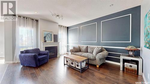 5331 Universal Crescent, Regina, SK - Indoor Photo Showing Living Room With Fireplace