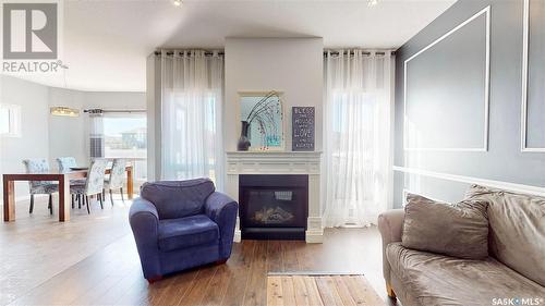 5331 Universal Crescent, Regina, SK - Indoor Photo Showing Living Room With Fireplace