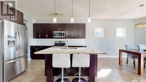 5331 Universal Crescent, Regina, SK - Indoor Photo Showing Kitchen With Stainless Steel Kitchen With Double Sink With Upgraded Kitchen