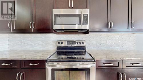 5331 Universal Crescent, Regina, SK - Indoor Photo Showing Kitchen With Stainless Steel Kitchen With Upgraded Kitchen