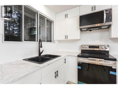 728 Arbutus Road, Lumby, BC - Indoor Photo Showing Kitchen With Double Sink