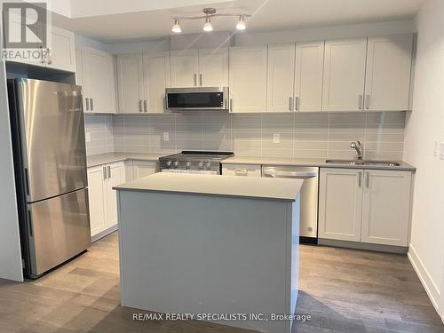 142 - 1060 Douglas Mccurdy Comm, Mississauga, ON - Indoor Photo Showing Kitchen With Double Sink