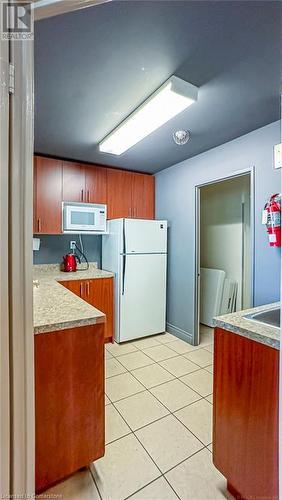 Party room kitchen. - 4450 Tucana Court Unit# 1010, Mississauga, ON - Indoor Photo Showing Kitchen