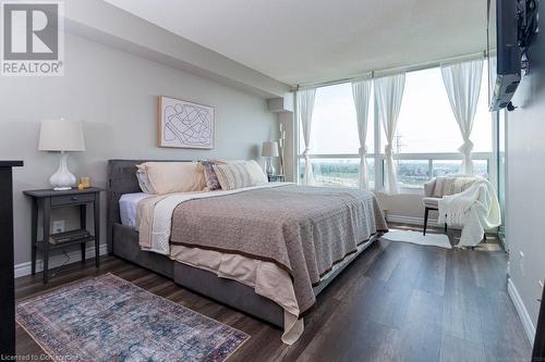 Spacious enough for a king bed, sitting nook, dresser and much more. Floors: Lifeproof Pebble Oak Water Resistant Laminate Flooring - 12mmx7.48 -inch x 47.72 inch Length. No carpeting = priceless. - 4450 Tucana Court Unit# 1010, Mississauga, ON - Indoor Photo Showing Bedroom