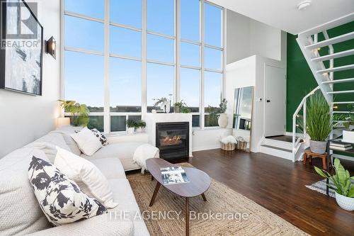 526 - 250 Manitoba Street, Toronto, ON - Indoor Photo Showing Living Room With Fireplace