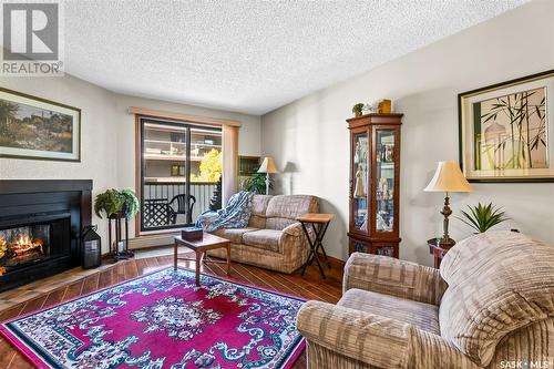 206 55 Wood Lily Drive, Moose Jaw, SK - Indoor Photo Showing Living Room With Fireplace