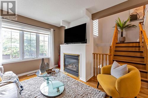 12 - 1735 Walnut Lane, Pickering, ON - Indoor Photo Showing Living Room With Fireplace