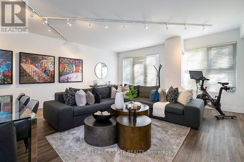 114 - 77 Mcmurrich Street, Toronto, ON - Indoor Photo Showing Living Room