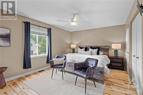 Spacious primary bedroom with new hardwood flooring - 70 Lachaine Street, Embrun, ON - Indoor Photo Showing Bedroom