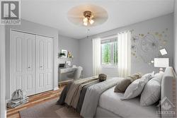 Image is virtually staged. Bedroom also features new hardwood flooring - 