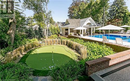 Private putting green and inground trampoline! - 27 Park Avenue, Oakville, ON - Outdoor With In Ground Pool With Backyard