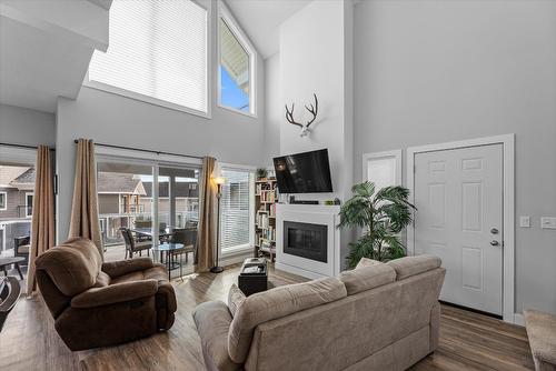 410-6956 Terazona Loop, Kelowna, BC - Indoor Photo Showing Living Room With Fireplace