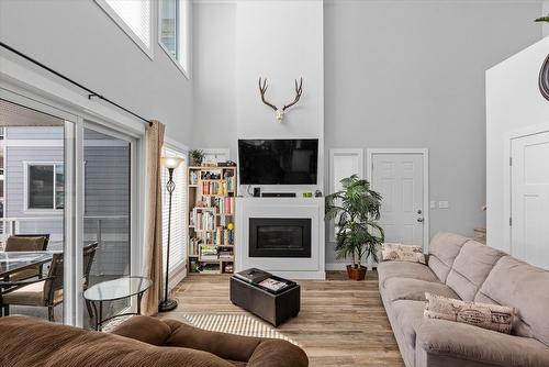 410-6956 Terazona Loop, Kelowna, BC - Indoor Photo Showing Living Room With Fireplace