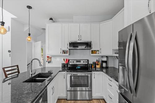 410-6956 Terazona Loop, Kelowna, BC - Indoor Photo Showing Kitchen With Double Sink With Upgraded Kitchen