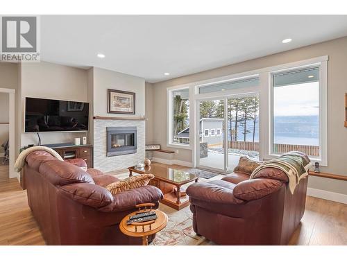 7255 Dunwaters Road, Kelowna, BC - Indoor Photo Showing Living Room With Fireplace